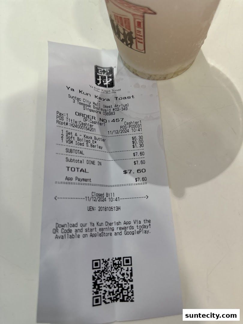 A receipt from Ya Kun Kaya Toast with a cup in the background.