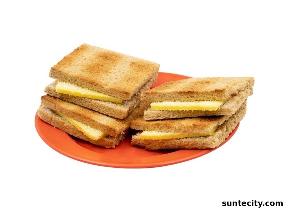 A plate of kaya toast sandwiches with butter filling.