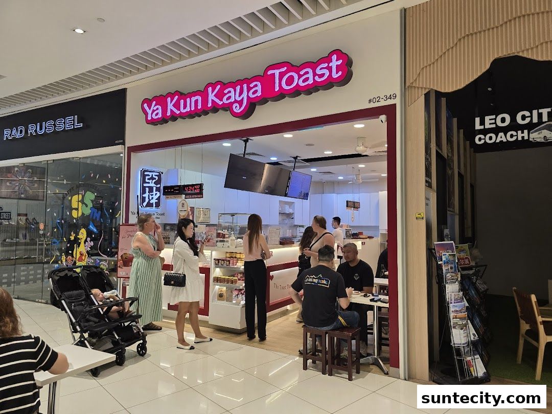 The entrance of Ya Kun Kaya Toast with customers inside and waiting.
