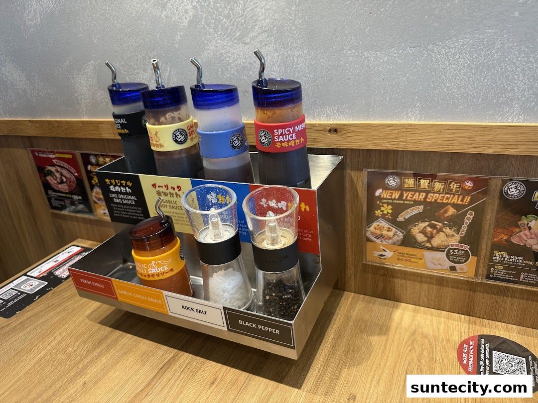 Condiments and sauces are displayed on a table at Yakiniku Like Suntec City.