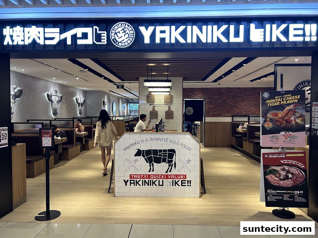 The entrance of Yakiniku Like Suntec City, featuring its prominent signage and interior seating.