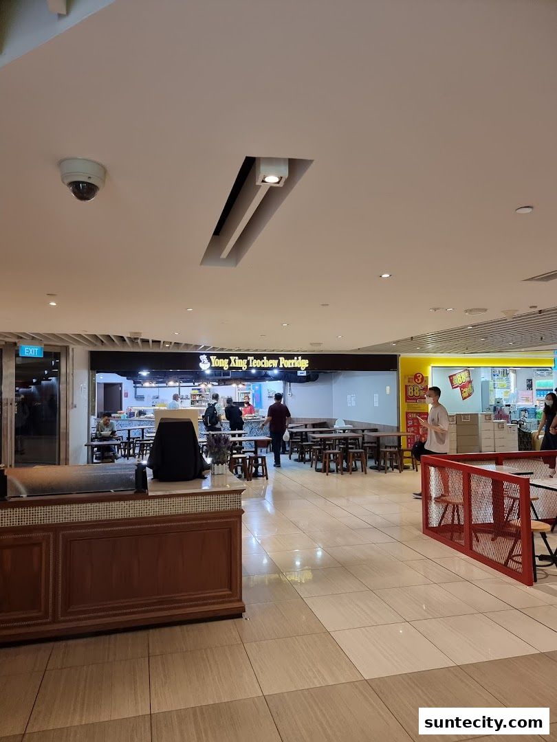 Interior view of Yong Xing Teochew Porridge restaurant with seating and counter.